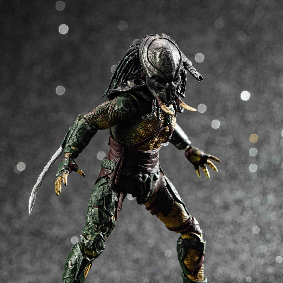 Predator action figure on a dark background
