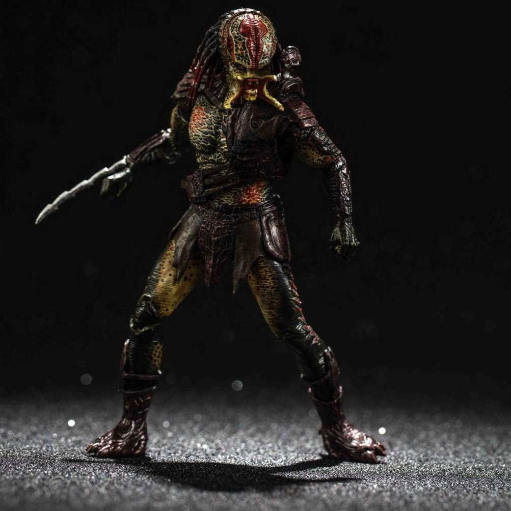Action figure of a character from Predators on a dark background