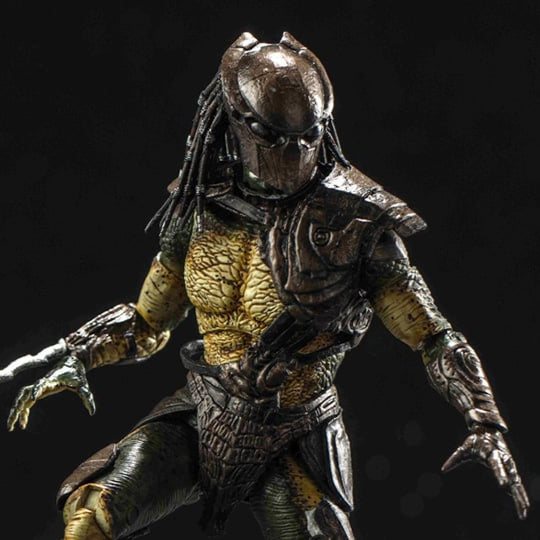 Predator action figure with a dark background