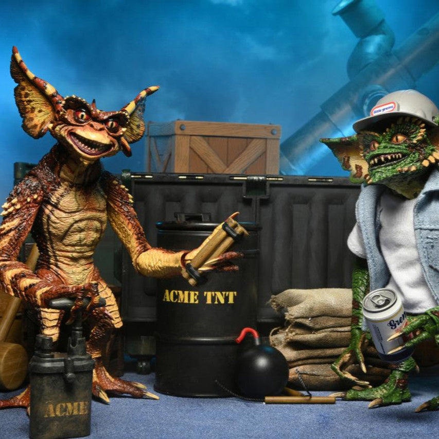 Two action figures in a setting with 'ACME TNT' and 'ACME' branding.