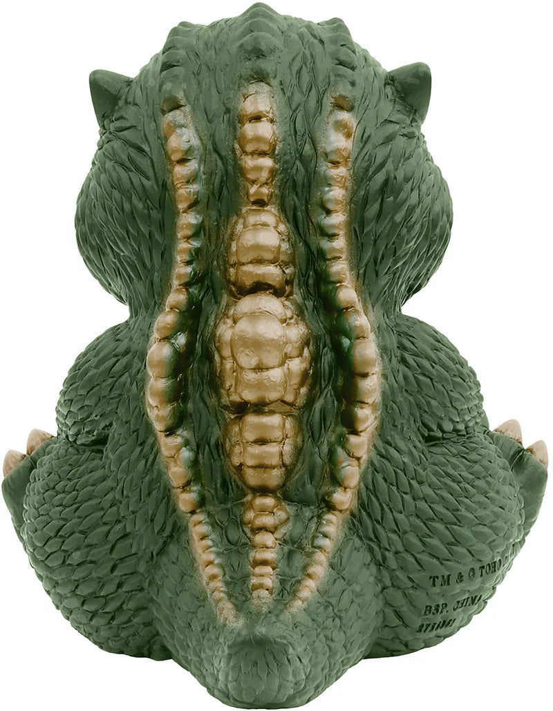 Green dragon-shaped object on a white background