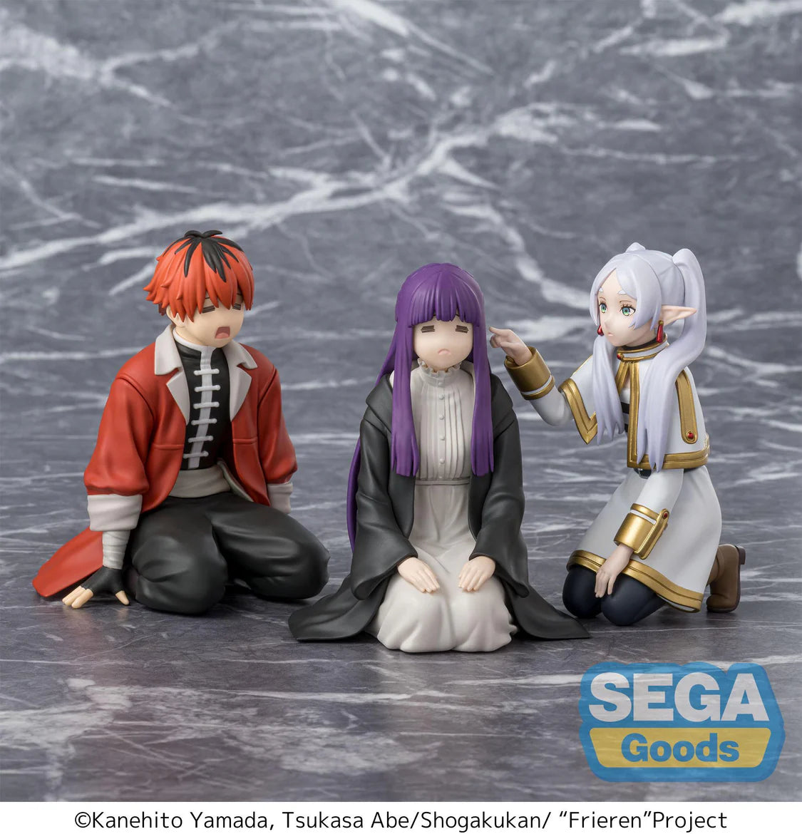 Three anime-style figurines from the show 'Frieren' on a gray marble surface with 'Sega Goods' branding. - Action Figures - Anime