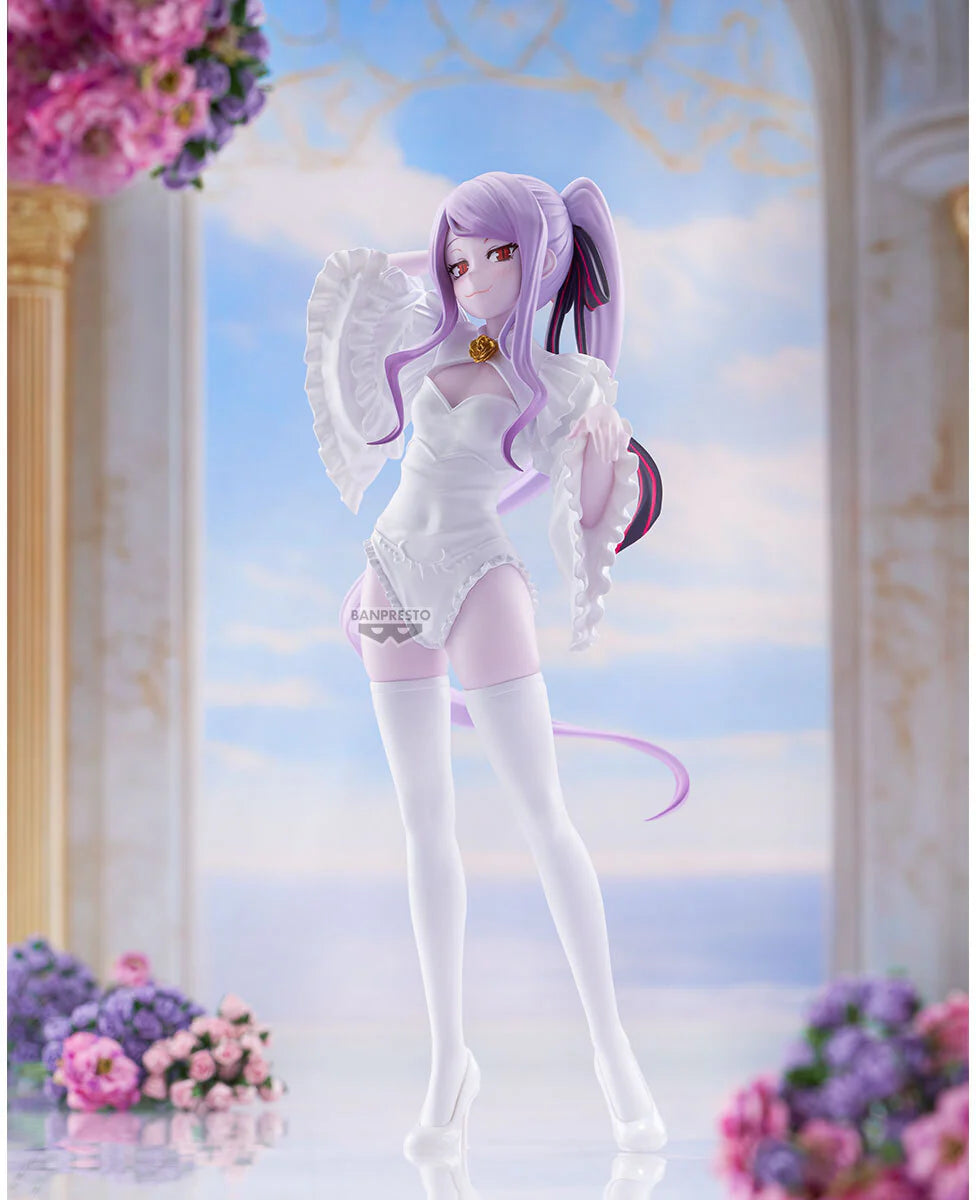A stylized anime figurine of a female character with lavender hair, white angel wings, and a white-and-pink outfit, posed in a decorative interior scene with flowers and a soft blue sky backdrop. - Statues
