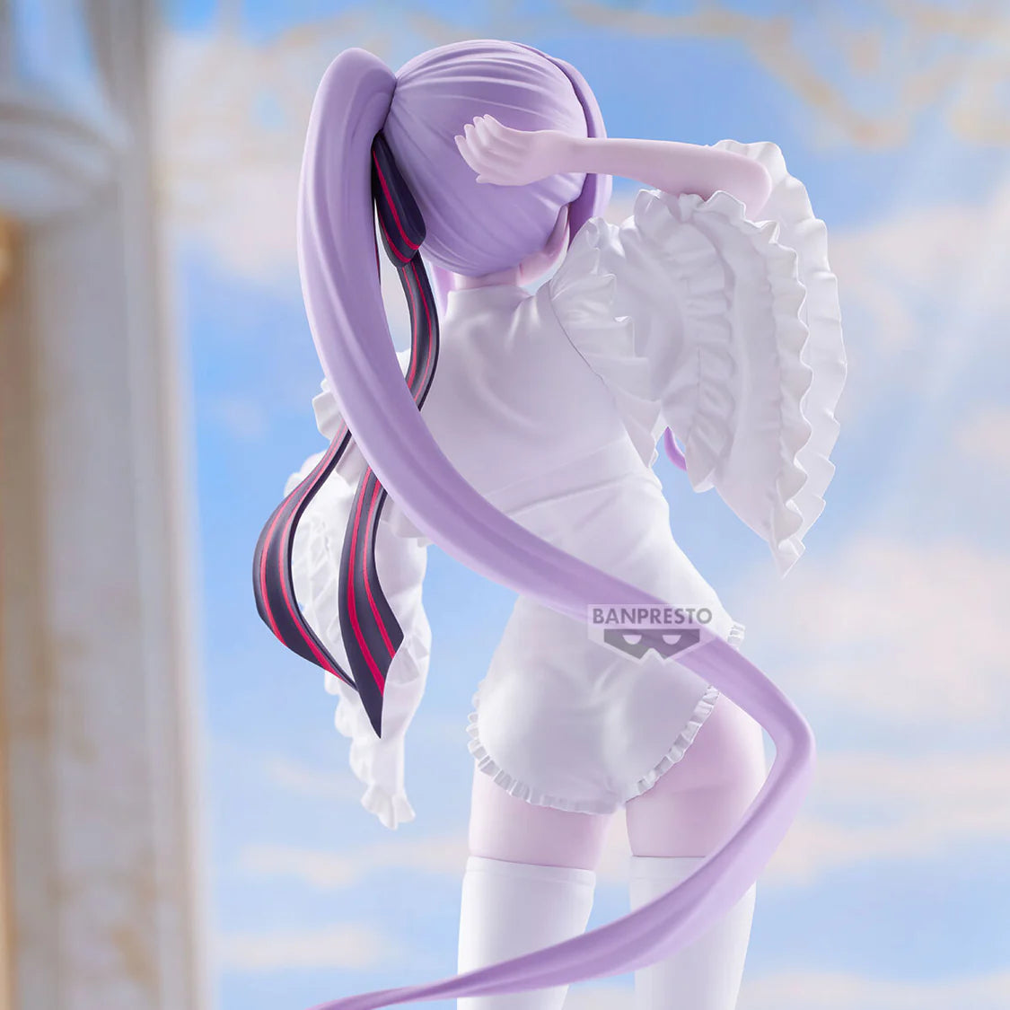 Shalltear Figurine with long purple hair and white outfit against a blurred background - Statues