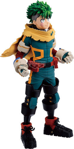 Action figure with green hair and colorful outfit on a white background - Statues
