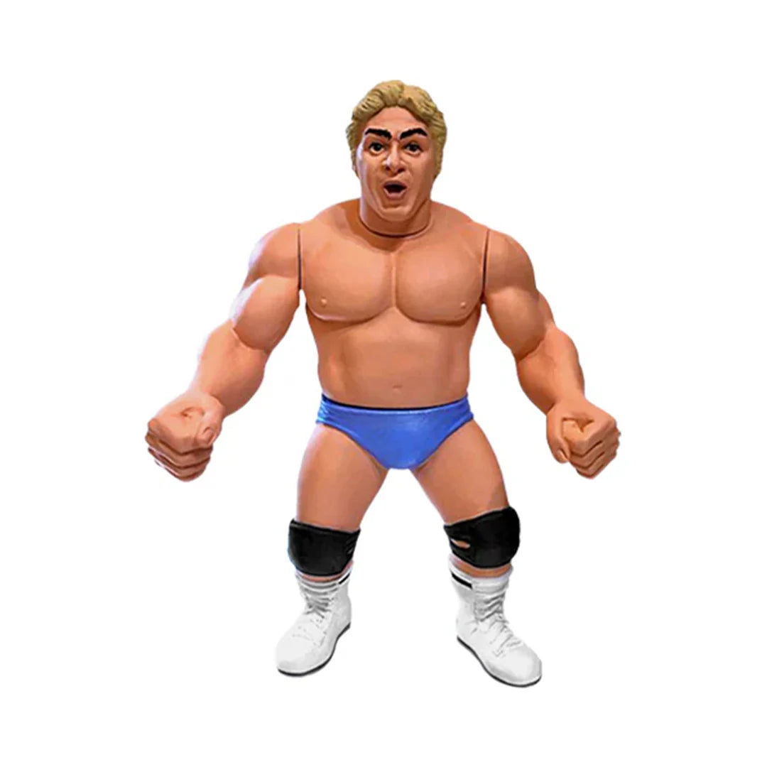 Dino Bravo Wrestling’s Heels and Faces action figure in blue trunks, black knee pads, and white boots. - Action Figures - Wrestling
