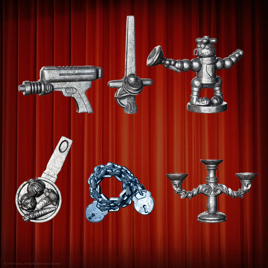 Collection of metallic figurines on a red curtain background