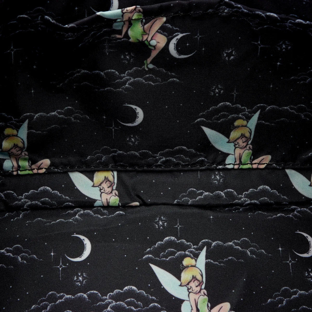 Pattern of fairies and moons on a black fabric background