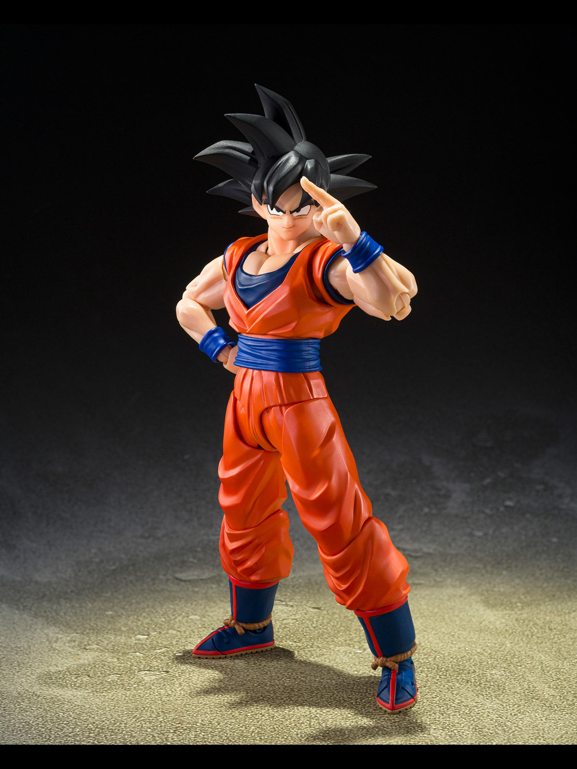 Son Goku The Kind-Hearted Saiyan figure posed in a forward fighting stance with clenched fists.