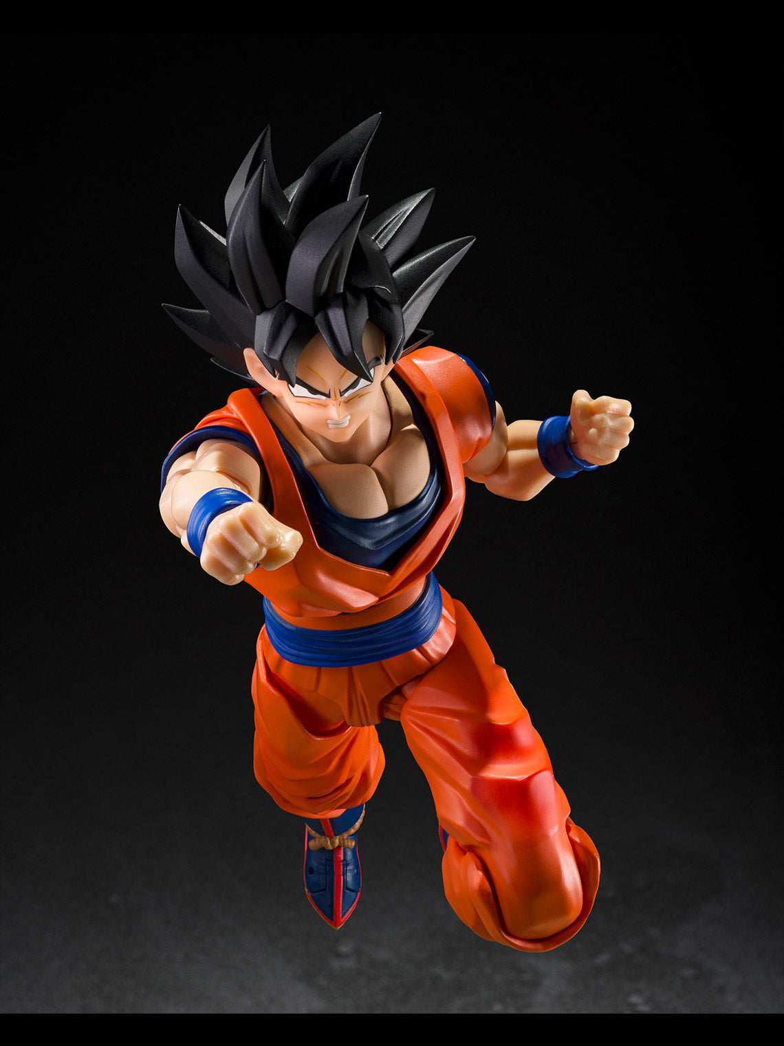 Son Goku S.H.Figuarts action figure posed in a low martial-arts stance with open hands.