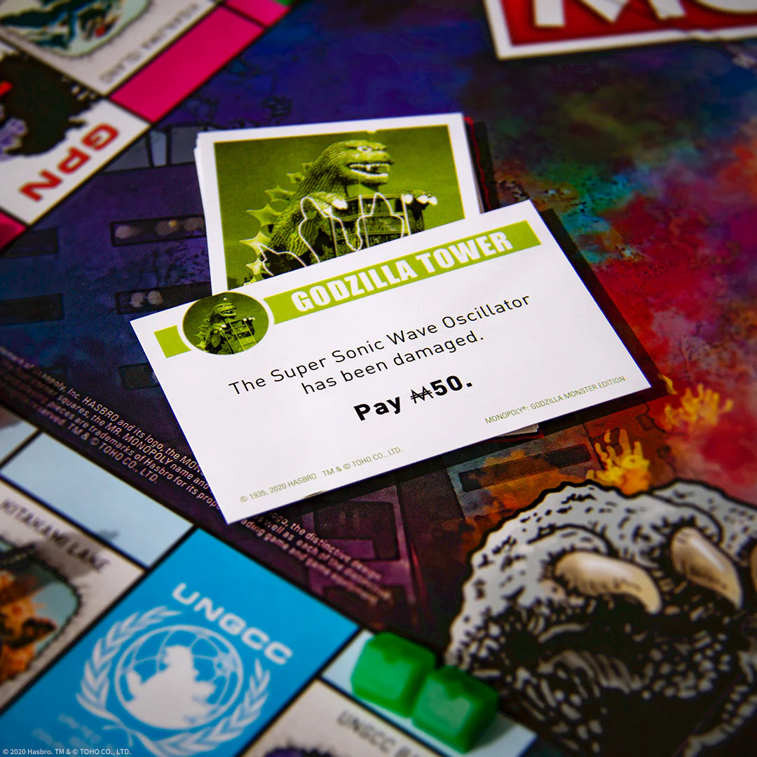 Board game card featuring Godzilla Tower on a colorful board background