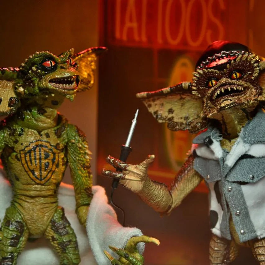 Two Gremlin action figures from the movie 'Gremlins' in a close-up shot.