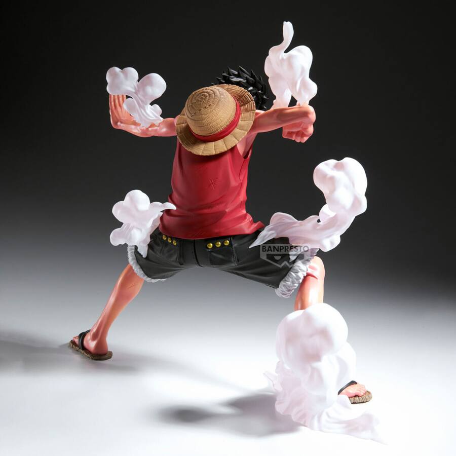 Action figure of Monkey D. Luffy with a straw hat and red shirt, standing on a gray background. - Action Figures - Anime - One Piece