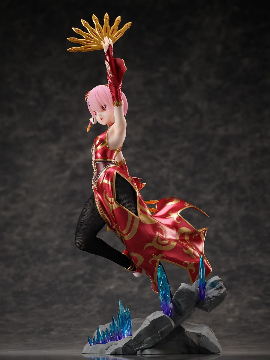 Animated character figurine in red and black outfit with gold accents on a dark background - Action Figures - Anime