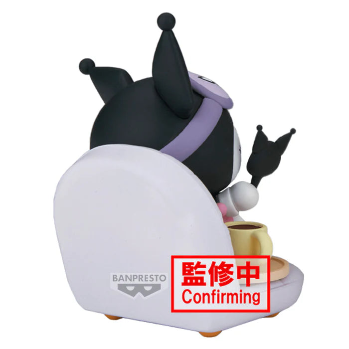 Alternate view of Kuromi looking into a black jester cap-shaped mirror beside a yellow skull cup and saucer.
