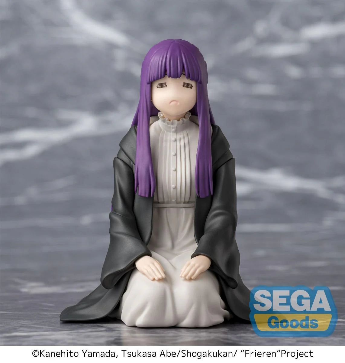 Figurine of Fern with purple hair and gray outfit on a gray background with Sega Goods logo.
