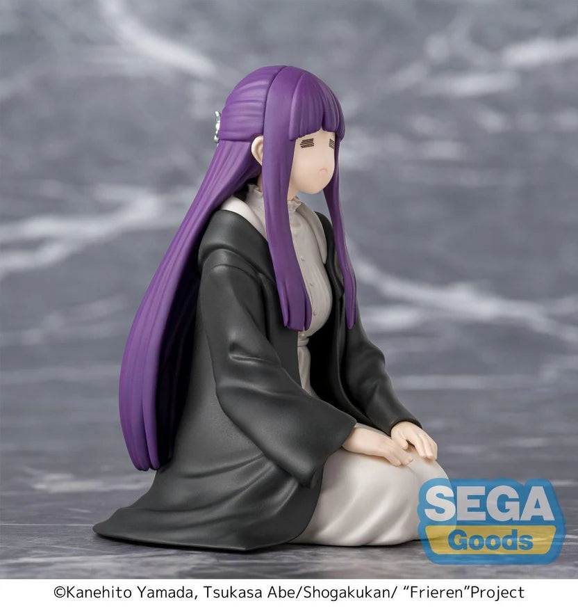 Figurine of Fern with long purple hair and black and gray outfit on a gray background, featuring Sega Goods logo.