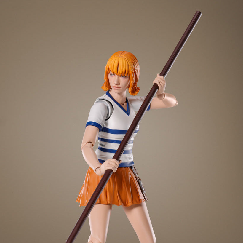 Figure of a character with orange hair holding a long pole against a brown background