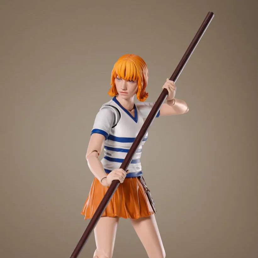 Figure of a character with orange hair holding a long pole against a brown background