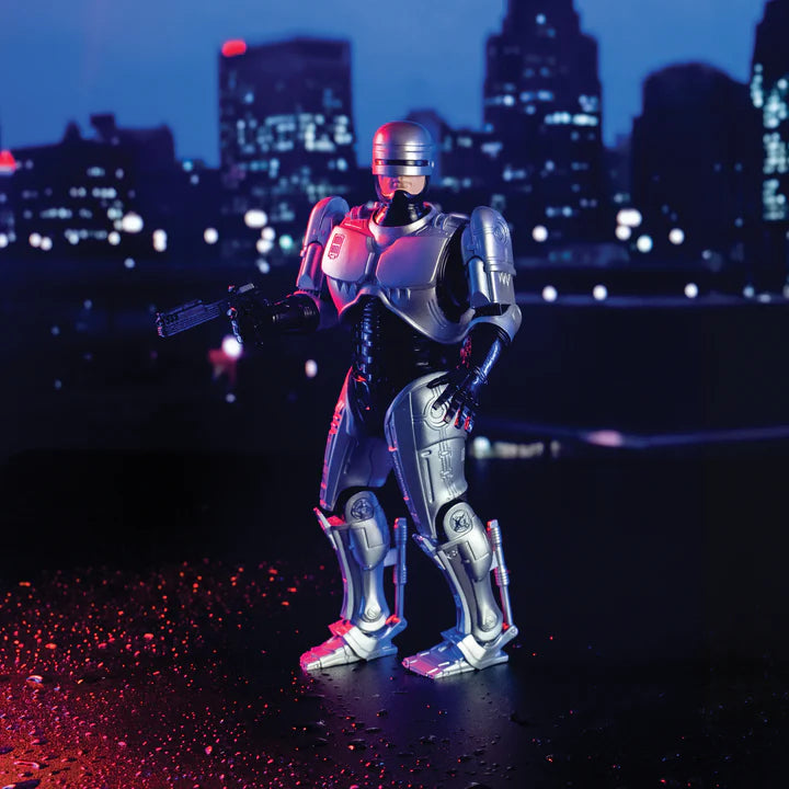 RoboCop figure on a rooftop with city skyline at night - Action Figures - Movies