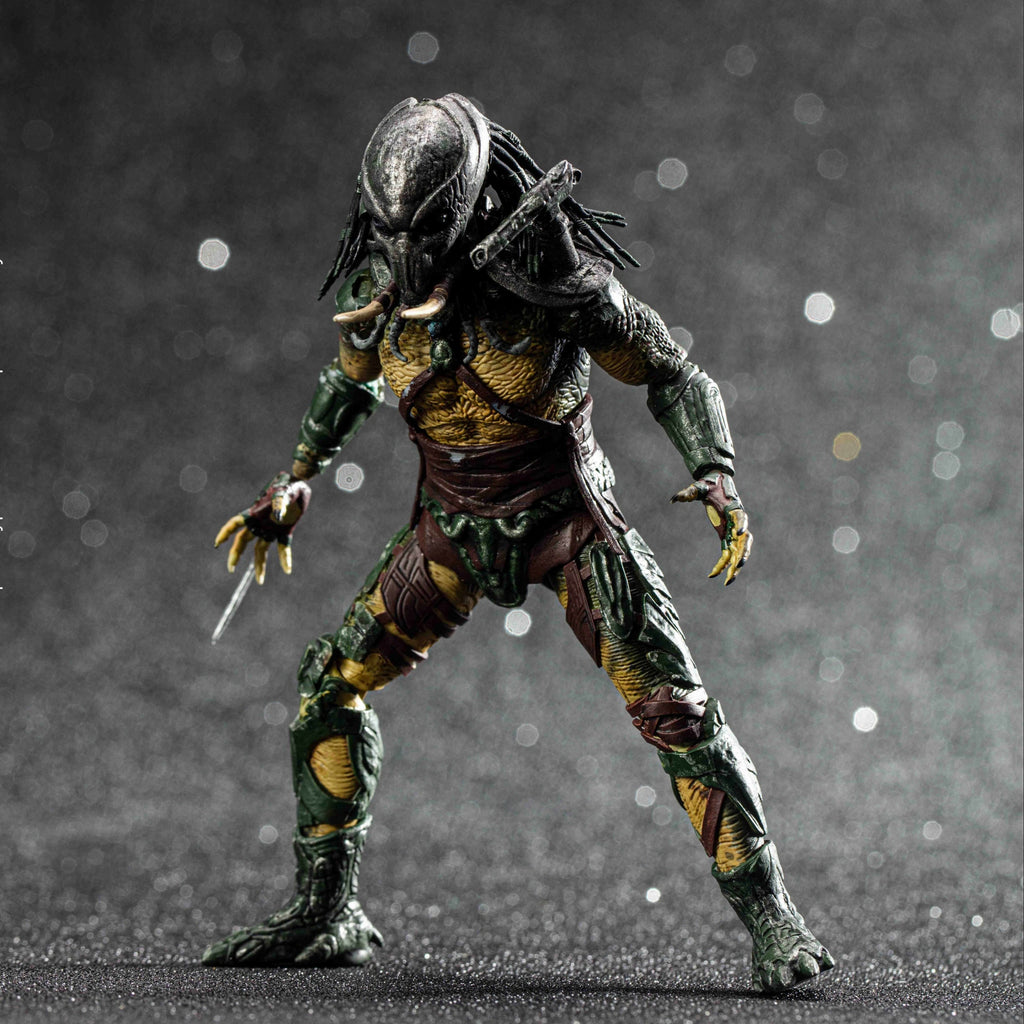 Predator action figure on a dark background
