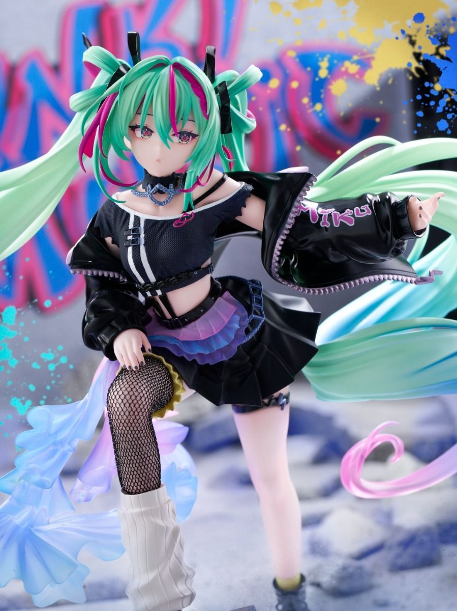 Hatsune Miku figurine with green hair and black outfit against a colorful background - Statues
