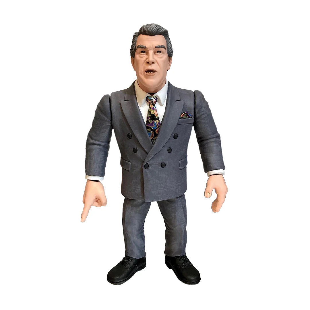 A collectible action figure of Jack Tunney in a gray double-breasted suit, white shirt, and a colorful paisley tie, standing against a plain white background.